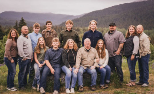 Outdoor family portrait of Wally and Mary's family, third, fourth, and fifth generation owners